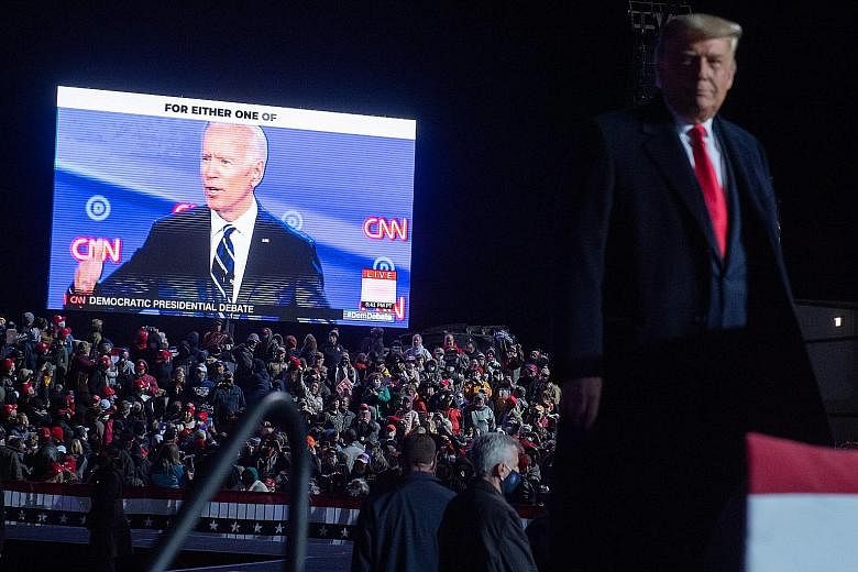 US President Donald Trump watching a video of Democratic presidential nominee Joe Biden during a campaign rally at Erie International Airport in Pennsylvania, on Tuesday. Polls conducted by The Financial Times and The New York Times suggest that like