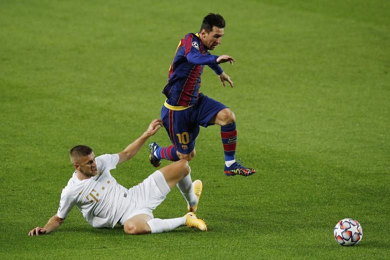 Barcelona captain Lionel Messi skipping past Ferencvaros' Eldar Civic during their Champions League match at the Nou Camp on Tuesday. He opened the scoring in the 5-1 win. PHOTO: REUTERS