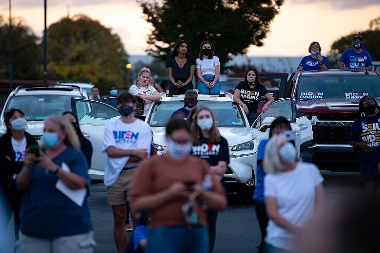 Attendees at Mr Obama's Wednesday drive-in rally, during which he offered his fiercest critique yet of his successor, taking aim at President Donald Trump's divisive rhetoric and his track record in the Oval Office. Former US president Barack Obama w