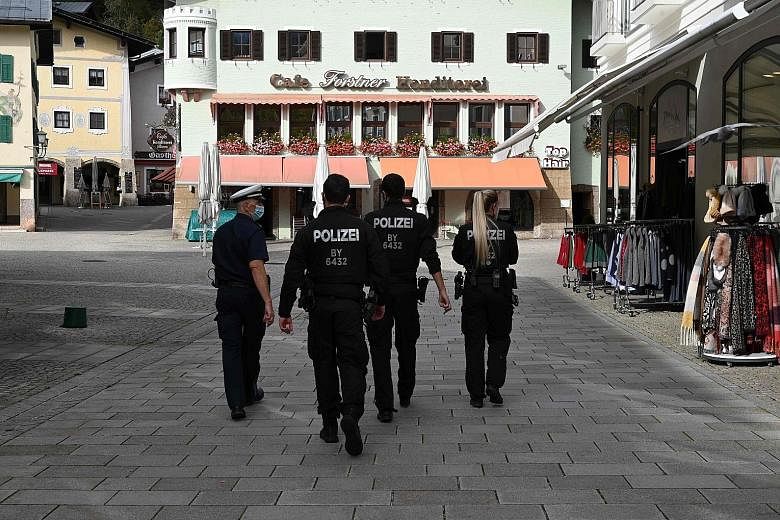 Police officers on patrol in Berchtesgaden, Germany, on Tuesday. The country has yet to reinstate very strict measures, unlike in some parts of Europe where total lockdowns are in place.