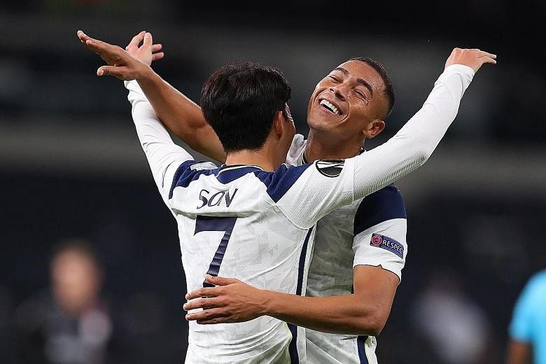 Tottenham's South Korean forward Son Heung-min celebrating with Spurs new boy Carlos Vinicius after scoring the third goal in the 3-0 Europa League win over Lask. The Brazilian had two assists on his debut.