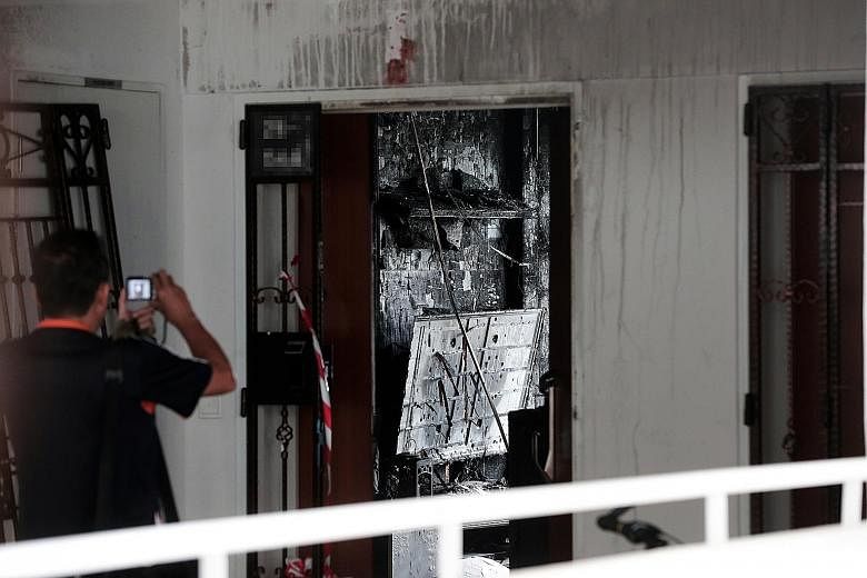 Private-hire driver Goh Keng Soon, 40, died two days after the fire broke out in his flat in Bukit Batok (left) in July last year. The coroner's court heard that the path to safety for him and his family might have been blocked as the burning persona