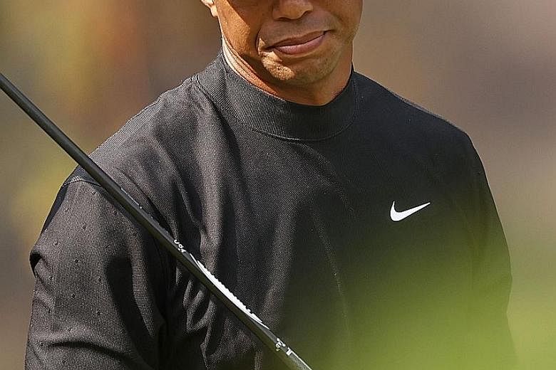 Tiger Woods showing his disappointment after his shot from the 13th tee during the first round of the Zozo Championship on Thursday. He carded a double-bogey seven there on his way to a four-over 76.