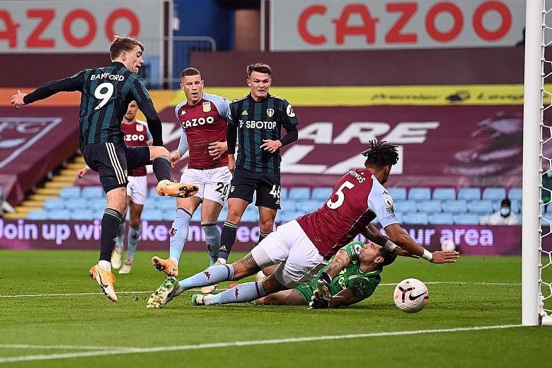 Patrick Bamford giving Leeds the lead against Aston Villa at Villa Park on Friday. The 27-year-old striker scored another two more, claiming his hat-trick in 19 second-half minutes. The 3-0 win ended the hosts' perfect record in the Premier League.