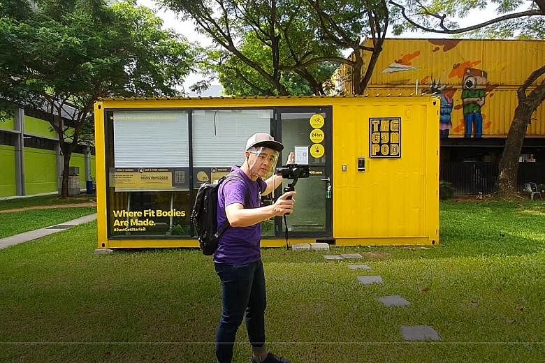 Monster Day Tours guide Byron Koh showing virtual tour participants around LaunchPad @ one-north, a precinct run by JTC Corporation for start-ups. Behind him is a gym operated by The Gym Pod. Twenty per cent of the tour participants are non-Singapore