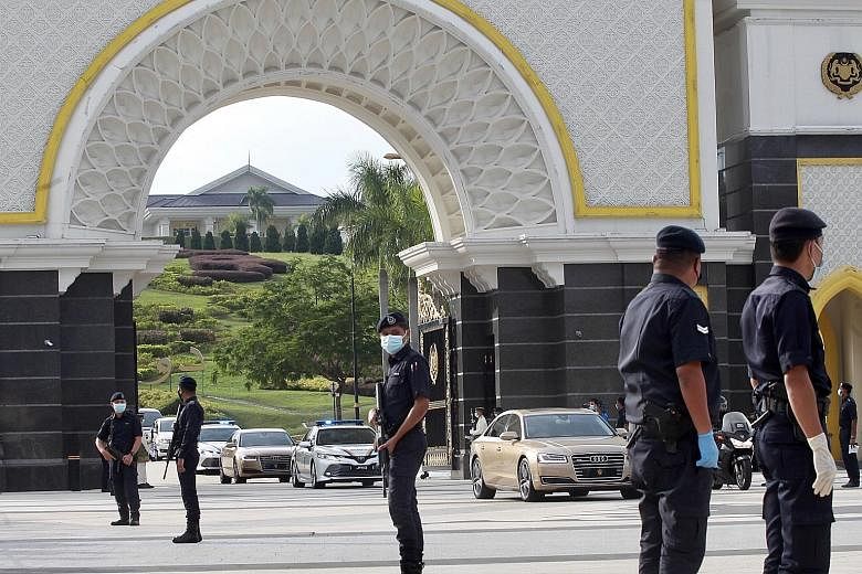 The Sultan of Johor's motorcade leaving the Istana Negara in Kuala Lumpur after a meeting of the Malay rulers yesterday. Despite rejecting the emergency plan, the remarks from the palace yesterday appeared to endorse Malaysian Prime Minister Muhyiddi
