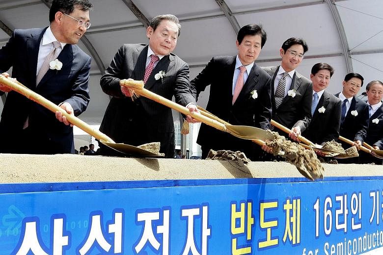 Samsung group chairman Lee Kun-hee (second from left) at a ceremony for a new semiconductor production line in 2010. Samsung described Mr Lee, who died yesterday, as a "true visionary" and said his legacy will be everlasting.