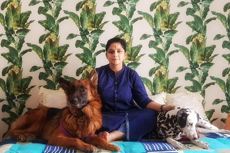 Ms Smita Sundararaman, who wound up her business in Gurgaon and moved to her home town of Lucknow in Uttar Pradesh, says her neighbour walks her two dogs every morning after she fractured her foot. PHOTO: KARAN SUNDARARAMAN