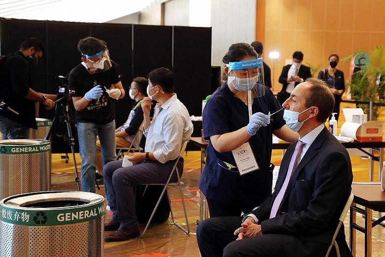 Participants being swabbed yesterday morning before attending conferences at the Singapore International Energy Week 2020. Around 215 tests were carried out yesterday, and most people appeared to have no issues with them. No one tested positive.
