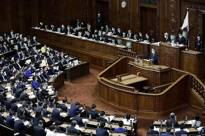 Japanese Prime Minister Yoshihide Suga making his debut policy speech in the Diet yesterday. Besides his environment pledges, he also discussed the need to revitalise a pandemic-hit economy.