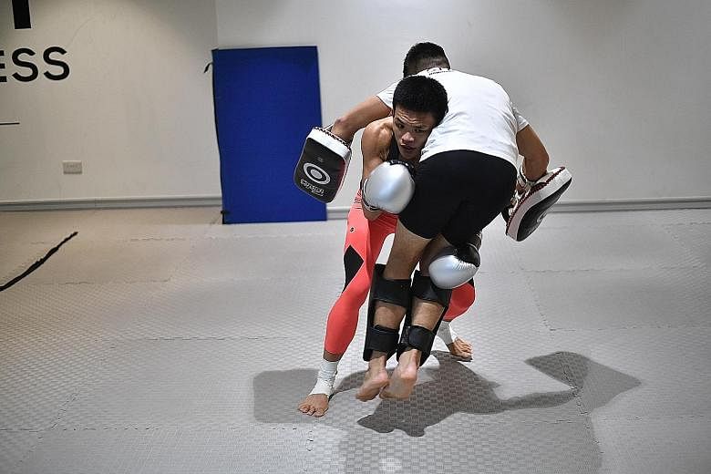 Above: Tiffany Teo in 2018. Left: Teo, shorn of her long locks, grappling with her trainer. She will attempt to become the first Singaporean world champion in One Championship when she takes on Xiong Jingnan on Friday for the Chinese fighter's straww