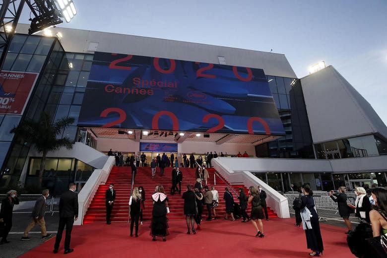 cannes film festival: Face masks, long gowns & movies: Quieter version of  Cannes rolls out red carpet for pared-back film showcase - The Economic  Times