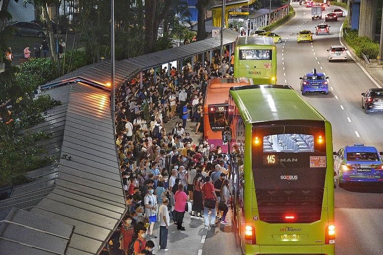Commuters stranded at Queenstown MRT station after the three-line MRT breakdown on Oct 14 that affected 123,000 commuters.