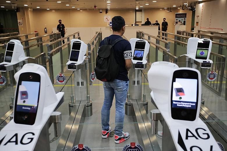 The Immigration and Checkpoints Authority's new iris and facial feature recognition technology at Woodlands Checkpoint. An iris scan provides almost 250 feature points for matching, as compared with about 100 points for a fingerprint. The facial scan