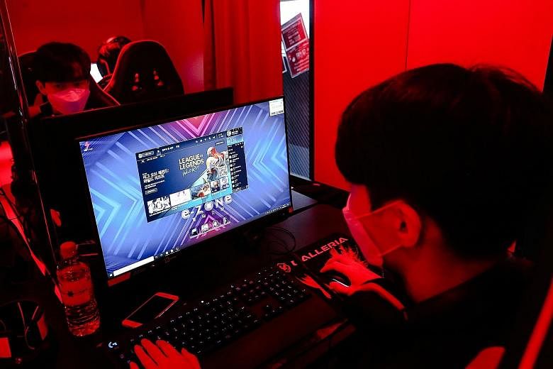 A gamer playing League Of Legends at Japanese e-sports hotel E-Zone Denno Kukan in Osaka. The e-sports industry has legions of loyal viewers who follow popular streamers or competitions for games such as this one.