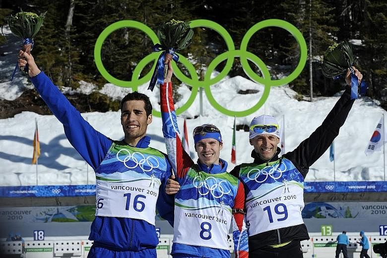 Evgeny Ustyugov (centre), France's Martin Fourcade (left) and Slovakia's Pavol Hurajt at the 2010 Vancouver Winter Olympics