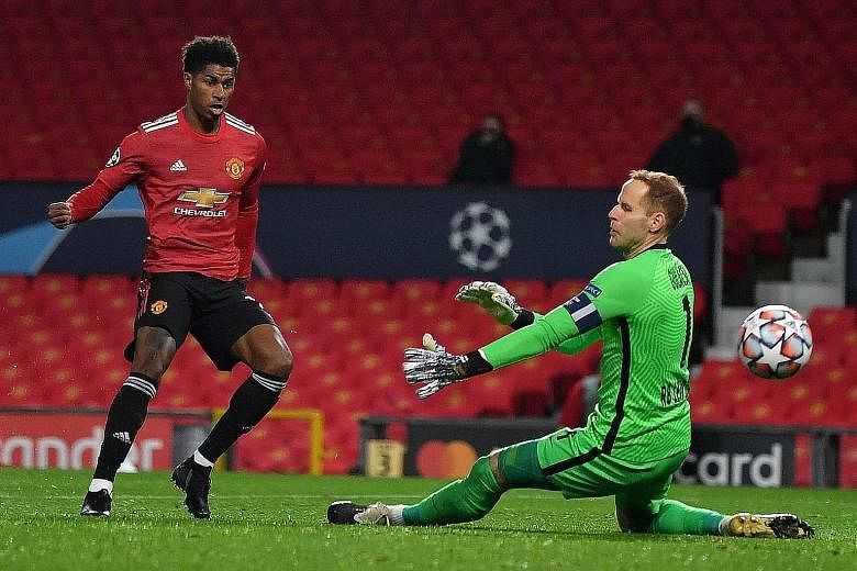 Marcus Rashford finishing past Peter Gulacsi for his team's second goal after coming off the bench. He completed a hat-trick to cap Manchester United's 5-0 drubbing of Leipzig.