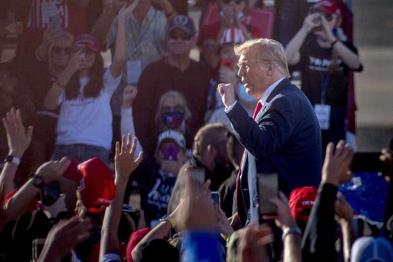 US President Donald Trump at a rally at Goodyear Airport in Phoenix, Arizona, on Wednesday. The pandemic that has upended life across the US, killing more than 227,000 people, is roaring back in the days leading up to next Tuesday's contest between t