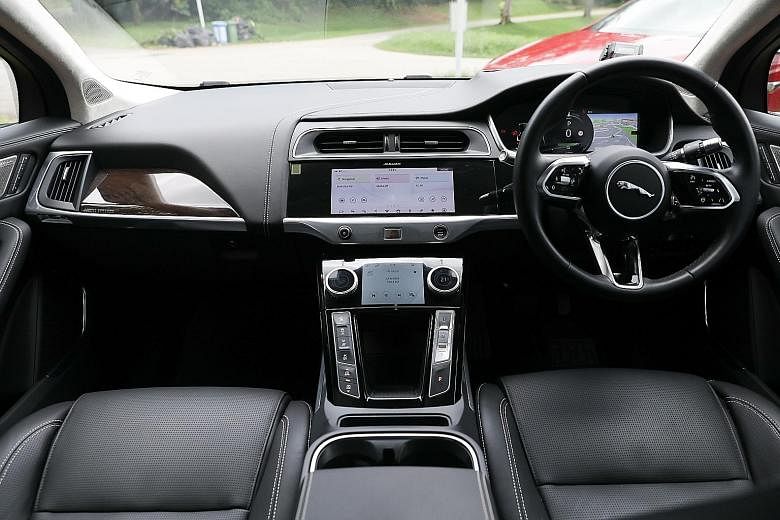 The Tesla Model X (above, left) and the Jaguar I-Pace (above, right). The Tesla Model X has a 17-inch portrait-style touchscreen, on which you can access a full suite of settings and ancillary controls. The Jaguar I-Pace's centre console retains phys