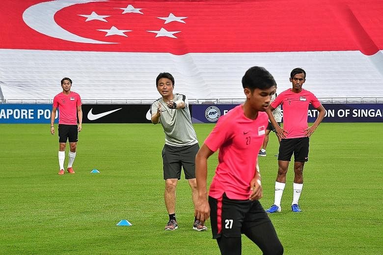 Singapore coach Tatsuma Yoshida, seen instructing the Lions in a training session, has been lauded by Minister for Culture, Community and Youth Edwin Tong for his work in leading the national football team. Since taking over in June last year, Yoshid