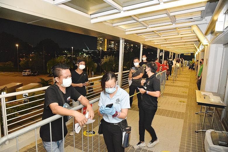 Some 250 spectators were seated apart at One Championship's Inside The Matrix event at the Singapore Indoor Stadium yesterday. The event is part of a pilot project that the Government hopes can pave the way for larger-scale ones to resume safely. Fan