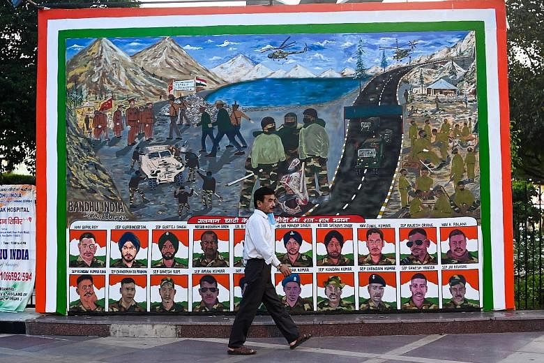 A poster in New Delhi depicting portraits of Indian soldiers killed during a border clash with Chinese troops in June. PHOTO: AGENCE FRANCE-PRESSE