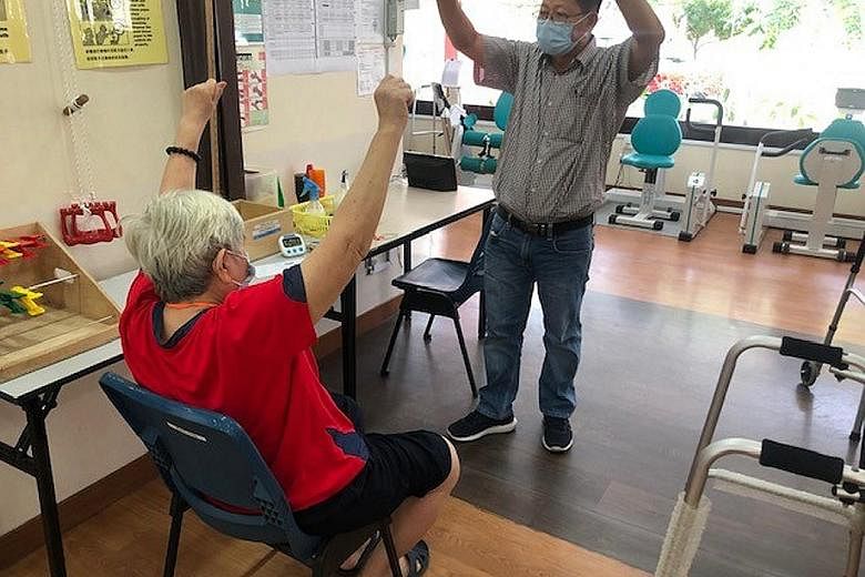 To overcome manpower constraints amid Covid-19, The Salvation Army Peacehaven Nursing Home employed staff from SG Healthcare Corps, such as this senior care associate (above). A client at social service agency Awwa being reassessed by a staff member 