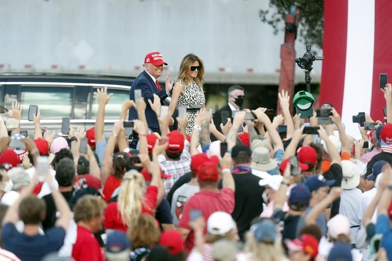 Democratic presidential candidate Joe Biden on stage at a "drive-in" campaign rally in Coconut Creek, Florida, on Thursday. Attendees remained in or near their cars to avoid the possible spread of Covid-19. They were also required to wear masks, but 