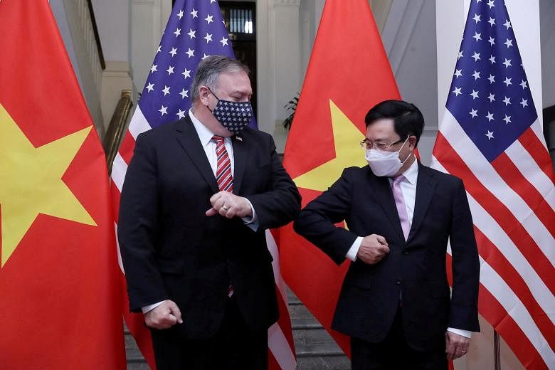 US Secretary of State Mike Pompeo and Vietnam's Deputy Prime Minister and Foreign Minister Pham Binh Minh in Hanoi yesterday. While ties between the two countries, once bitter enemies, have improved significantly over the years, some trade tensions h
