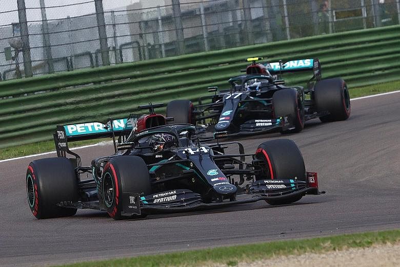 Lewis Hamilton en route to clinching his 93rd career victory at the Emilia Romagna Grand Prix in Imola yesterday, ahead of his Mercedes teammate Valtteri Bottas. PHOTO: EPA-EFE