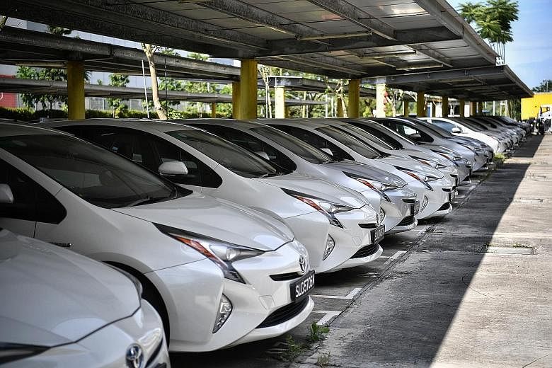 Unhired private-hire cars parked at Supply Chain City last week. Car certificate of entitlement (COE) premiums are hovering at their highest levels this year - with no immediate signs of a slide - despite a pandemicinduced economic slump. Experts say