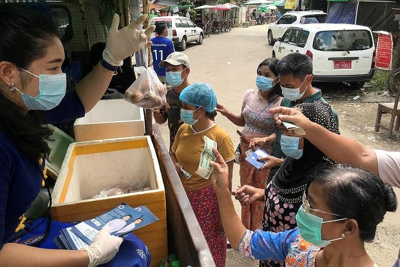 Ms Han Oo Khin, a candidate for the People's Pioneer Party, has been criss-crossing her constituency in the commercial capital of Yangon for more than a month with a truck selling affordable groceries. PHOTO: REUTERS