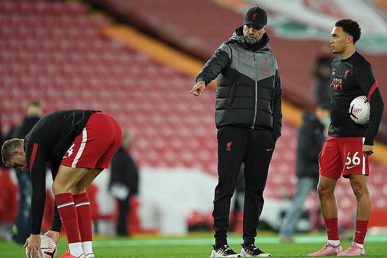 Liverpool manager Jurgen Klopp giving instructions to Trent Alexander-Arnold before the game against Sheffield United last month. After a tough start to the season, the Premier League champions top the table by two points over Tottenham.
