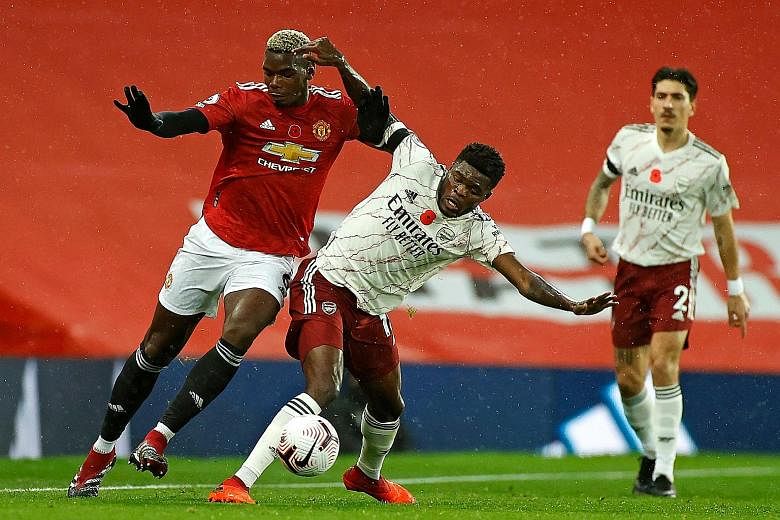 While Thomas Partey (white shirt) impressed with a solid shift in Arsenal's midfield, Manchester United's Paul Pogba had a torrid time, conceding a penalty while stranded on the wing for much of the game.