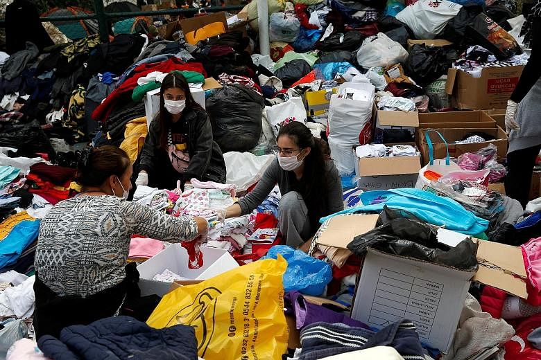 Clothing being collected and sorted out for survivors on Tuesday, after the earthquake struck the Aegean Sea, in the coastal province of Izmir last Friday. The quake injured 1,035 people in the city.