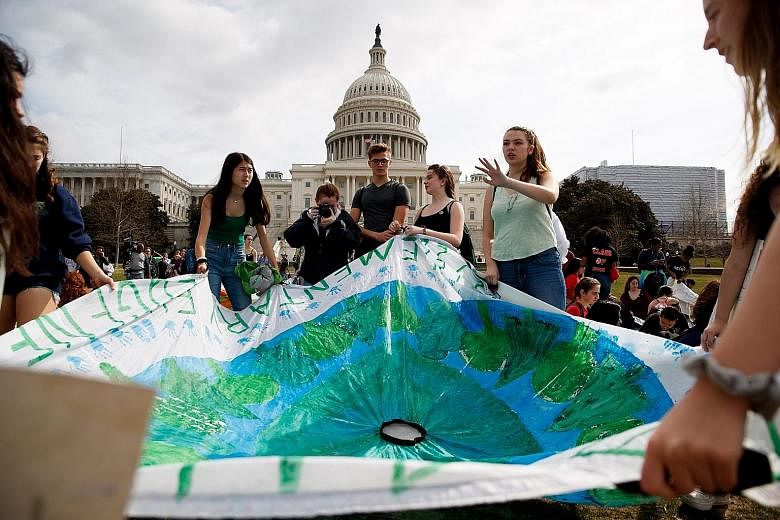 A 2019 file photo of students at a climate rally in Capitol Hill, Washington. United States President Donald Trump announced his intention to withdraw the US from the climate pact in June 2017. His administration formally served notice of the withdra