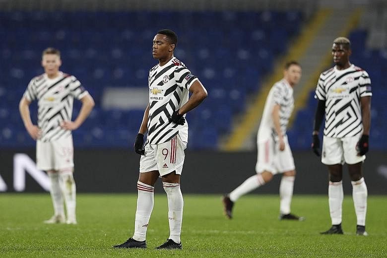 Manchester United's Anthony Martial (centre), Paul Pogba (right) and teammates looking dejected during the 2-1 Champions League defeat by Istanbul Basaksehir on Wednesday.