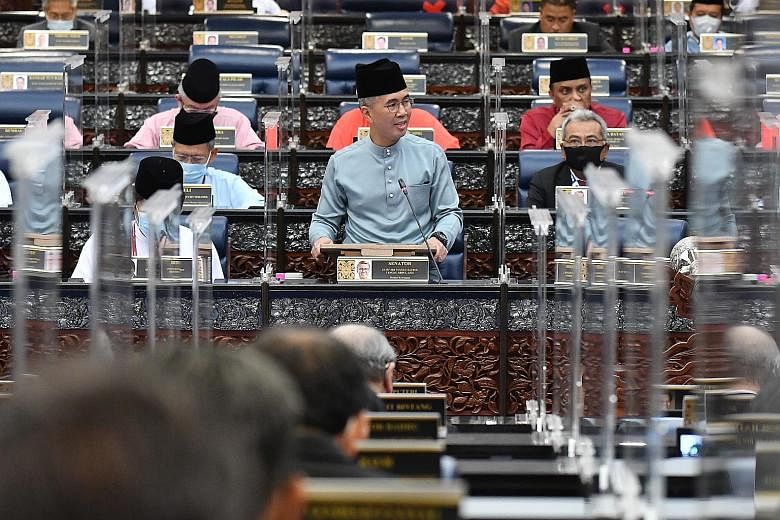 Malaysian Finance Minister Tengku Zafrul Aziz presenting Budget 2021 in Parliament in Kuala Lumpur yesterday. Prime Minister Muhyiddin Yassin had said earlier this week that his administration's first budget will be expansionary, in line with biparti
