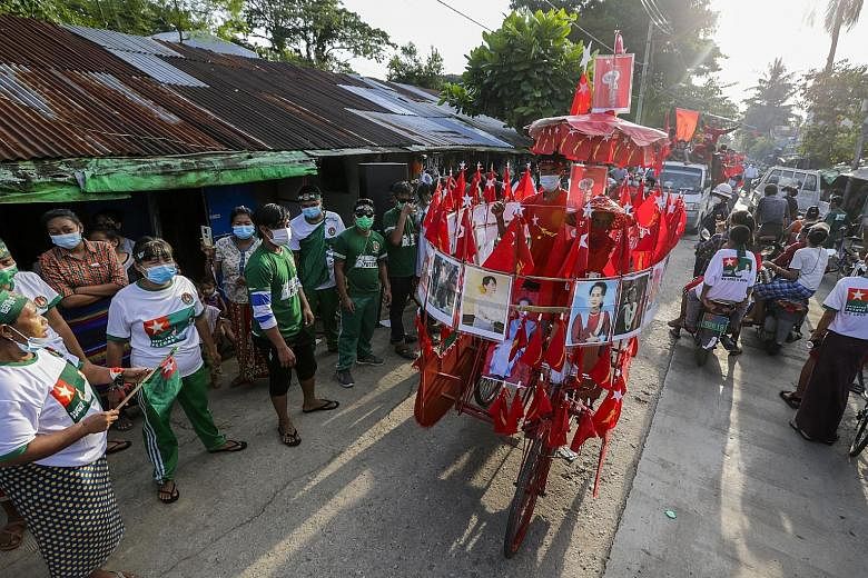 Union Solidarity and Development Party supporters singing their campaign song during a campaign event outside Yangon on Friday, two days before Myanmar's election.