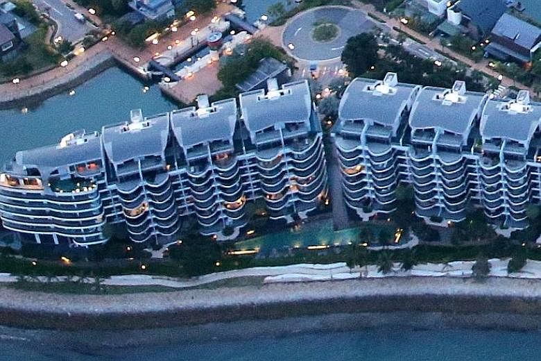 An aerial view of Seascape condo at Sentosa Cove. Projects like Turquoise and Seascape, which were sold in 2007 and 2010 at much higher prices, saw more losses when those units changed hands after cooling measures kicked in.