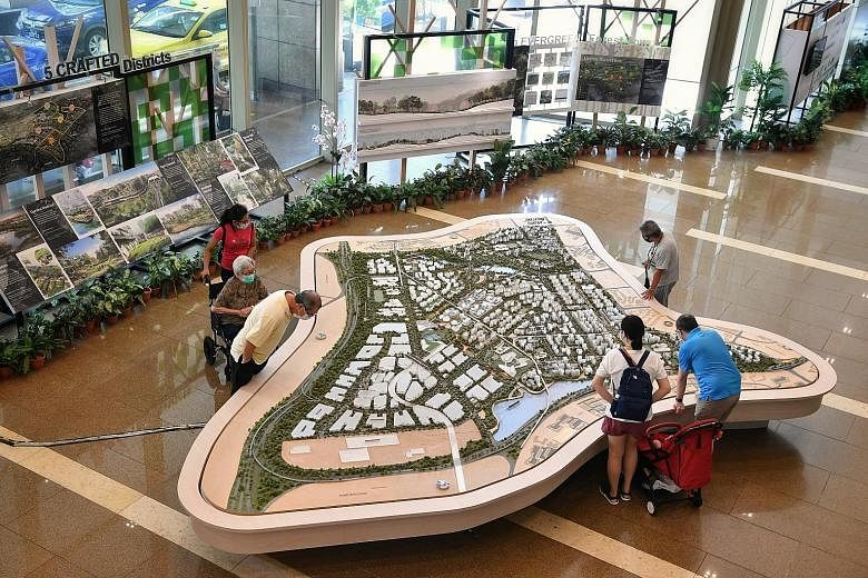 People viewing models of HDB estates at HDB Hub last month. The value of HDB flats should not be underestimated as they have paved the way for a smoother life journey for more Singaporeans than they have been given credit for, says the writer. Such f