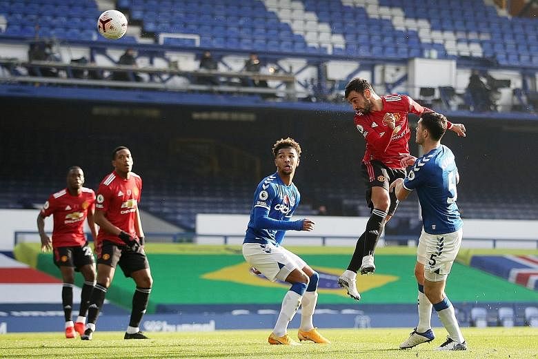 Bruno Fernandes meeting a Luke Shaw cross from the left with a perfectly angled header to equalise in yesterday's match at Everton. The midfielder scored twice and had an assist. PHOTO: REUTERS