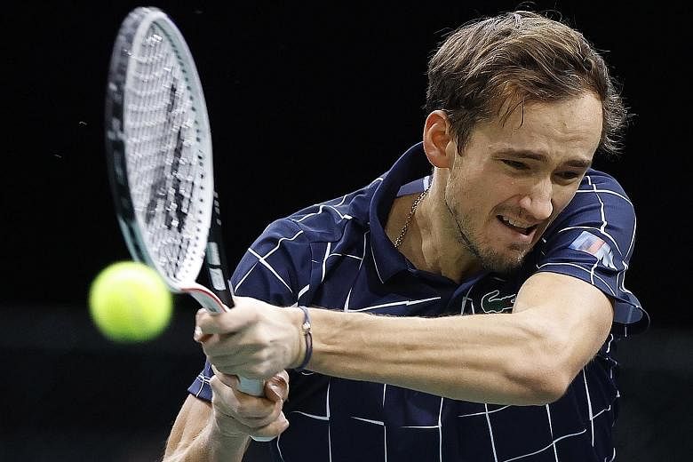 Russia's Daniil Medvedev powering to a 6-4, 7-6 (7-4) win over Canada's Milos Raonic in their Paris Masters semi-final yesterday. PHOTO: EPA-EFE