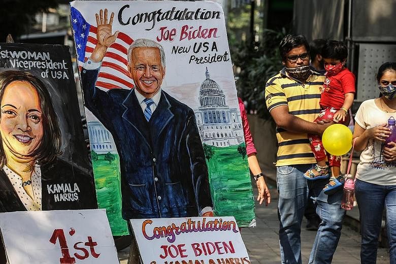 A painting in the Indian city of Mumbai yesterday showing the US' President-elect Joe Biden and his second-in-command Kamala Harris. Most government leaders in Asia have expressed hopes of strengthening ties with Mr Biden's administration and politic