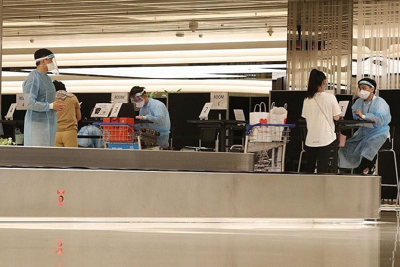 Arriving passengers from Shanghai at Changi Airport Terminal 1 last Friday. As part of the unilateral border opening, tourists and travellers flying into Singapore need not serve a stay-home notice if their Covid-19 test is negative. PHOTO: LIANHE ZA