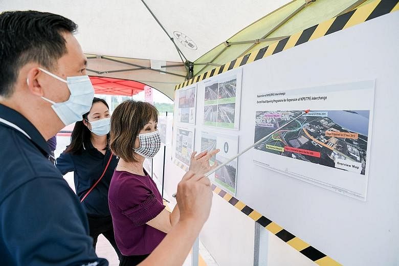 Senior Minister of State for Transport and Sustainability and the Environment Amy Khor getting an overview of the expansion of the interchange between the KPE and TPE from Land Transport Authority senior project manager Wong Fook Chee yesterday. PHOT