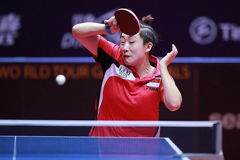 Singapore paddler Feng Tianwei (left) was beaten 4-2 by Lily Zhang in the round of 16 at the ITTF Women's World Cup in China. Feng had defeated the American in the bronze medal match at the same tournament last year.