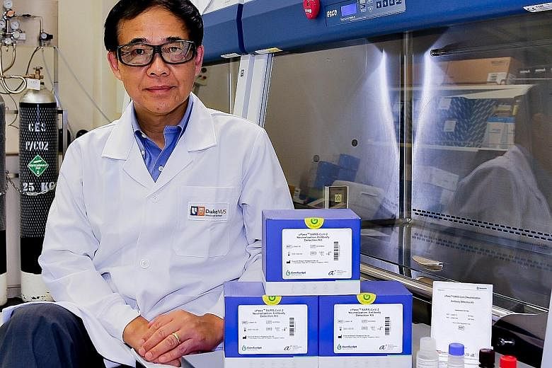 Professor Wang Linfa, director of Duke-NUS Medical School's emerging infectious diseases programme, with the cPass test kit. He led the team that invented cPass, which detects whether someone has antibodies that neutralise the coronavirus. PHOTO: DUK