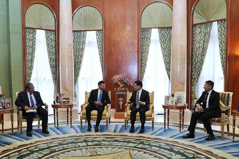 Deputy Prime Minister Heng Swee Keat meeting Crown Prince Al-Muhtadee Billah (both centre) in Brunei yesterday. With them were Dr Maliki Osman (right), Minister in the Prime Minister's Office of Singapore, and Brunei's Second Foreign Minister Erywan 