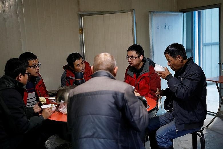 Staff members having breakfast at the Qilian Shan Station of Glaciology and Ecologic Environment of the Chinese Academy of Sciences, near the Laohugou No. 12 glacier in the Qilian mountains of Gansu province.